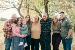 Group of people outdoors smiling together.