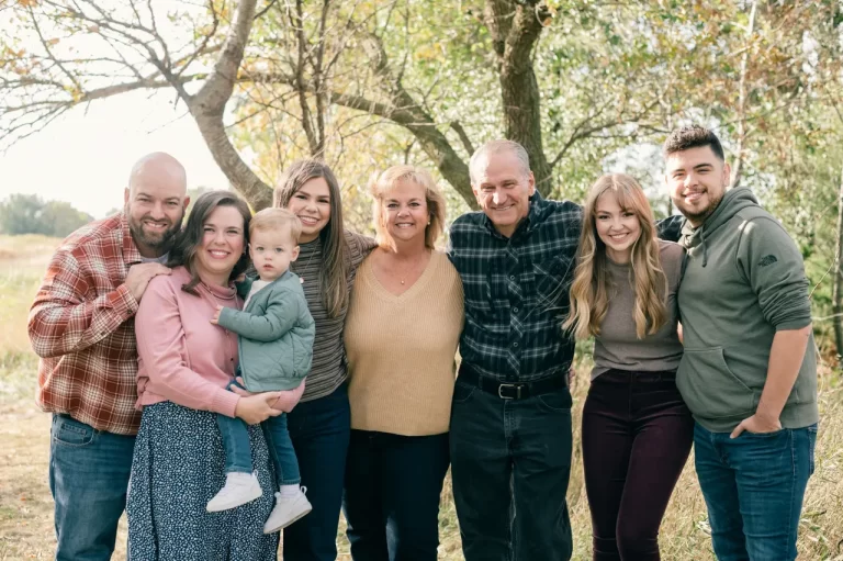 Group of people outdoors smiling together.